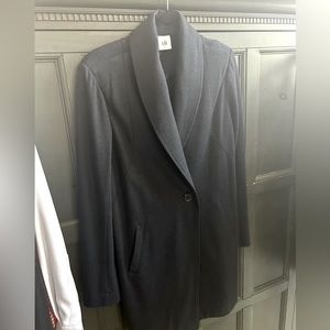 I love this Cabi coat . It’s a small grey/ blue jacket. It’s a long jacket .